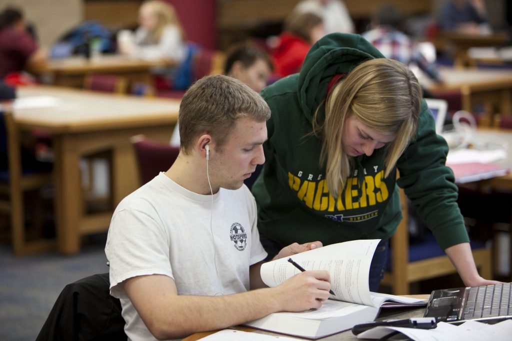 Two students work together on writing project