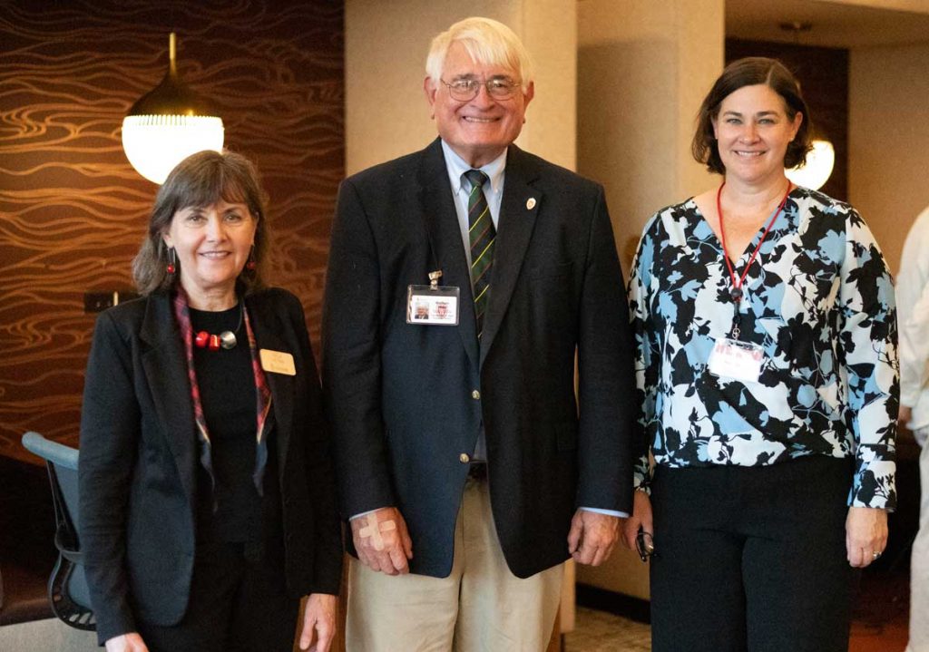 Libraries Dean and Vice Provost Erla Heyns poses with Michael West and Marcy Carlson, Associate Dean at the Graduate School at a Sept. 29, 2025 event announcing the new Michael A. West Graduate Room.