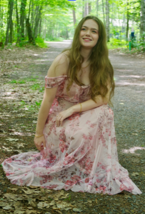 Artist, Kendra Seering, photographed in a forest